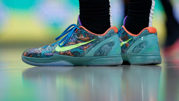 View of green and blue Nike Kobe shoes.